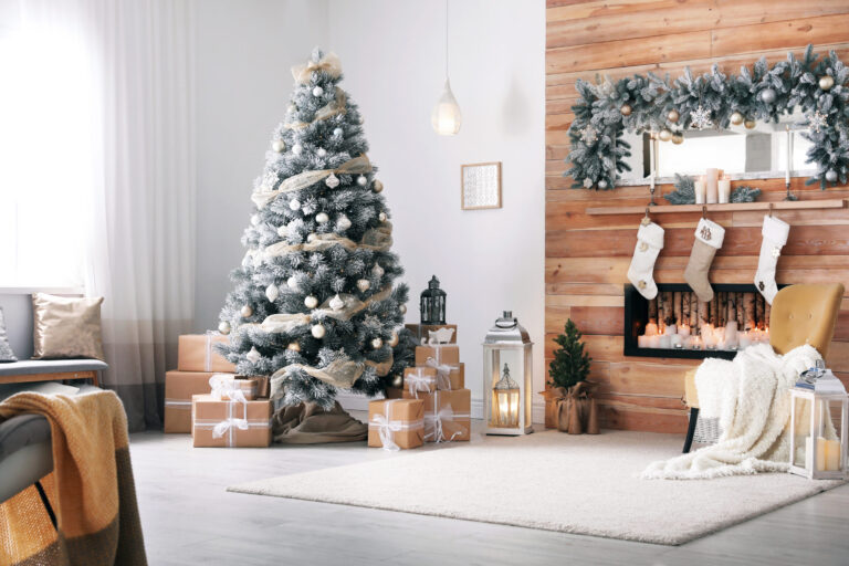 Christmas-decorated home with a beautifully adorned tree, garlands, and festive holiday decorations in a cozy living room. Christmas Storage Solutions with the Closet Butler.