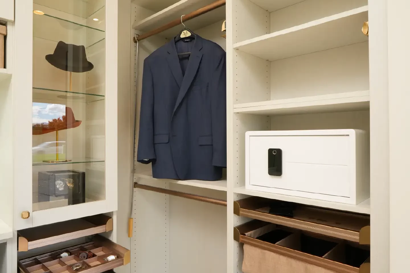 The closet butler trento showroom clothing showcase with accessory and safe.